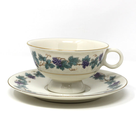 back view of teacup and saucer, from Theodore Haviland, in the Arbor pattern with grape clusters and leaves.