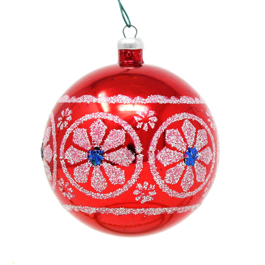 Red and blue Christmas ornament with floral patterns on a white background