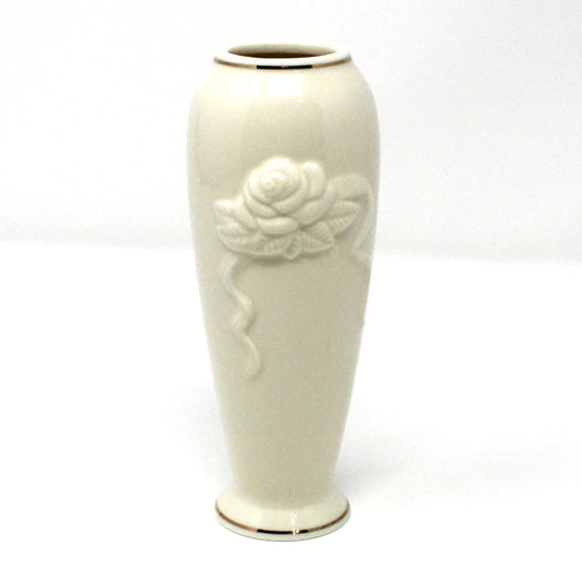 A vintage Lenox Vase, Rose Bloom collection.  Cream color porcelain bud vase with embossed rose and 24KT gold trim.
