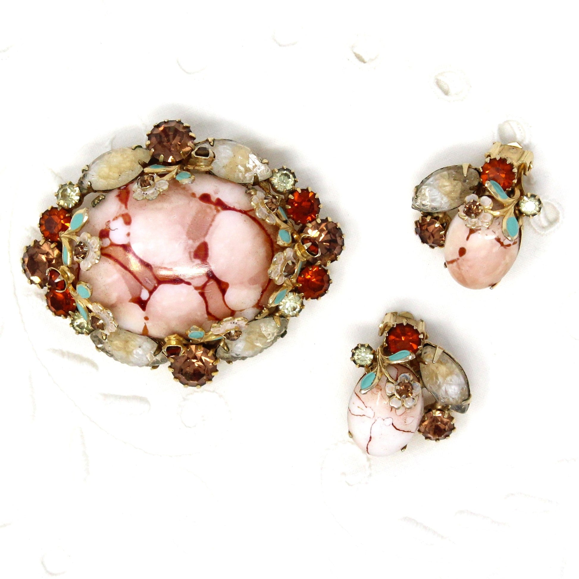 Vintage brooch and earrings set, Demi Parure.  Large pink marble cabochon with prong set rhinestones and enamel flowers and leaves, in gold tone. Vintage Brooch & Earrings Set, Pink "Matrix" Oval Marble Cabochon, Marquis Navette, Molded White Cabochons, Amber Rhinestones and Enamel Flowers and Leaves
