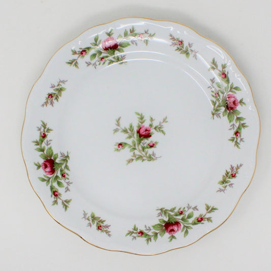 Vintage Johann Haviland, Moss Rose dessert or salad plate, with a floral pattern of small pink roses and green leaves, bordered by a gold rim.