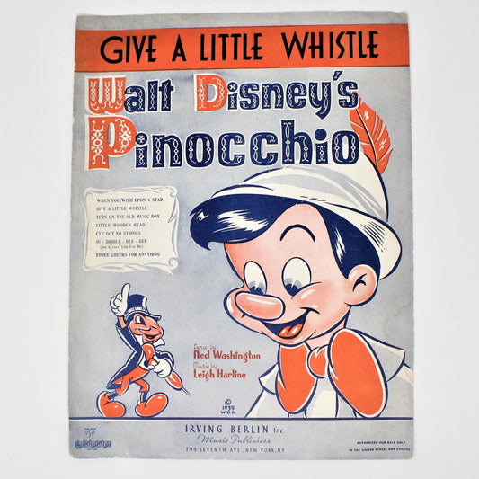 Vintage sheet music for Disney's Pinocchio, 'Give a Little Whistle' with an illustration of Pinocchio smiling and a small image of Jiminy Cricket