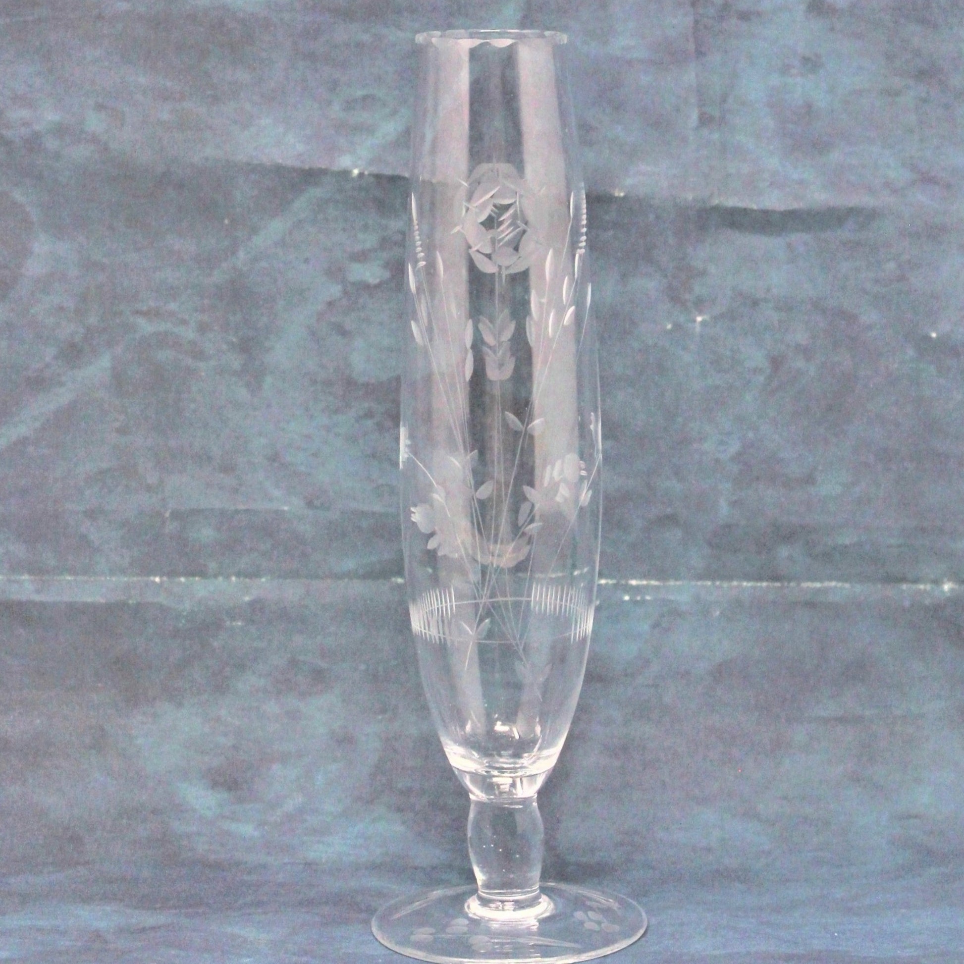 A clear etched glass vase with a floral design, featuring plum blossoms, and a scalloped rim, vintage 1970's.