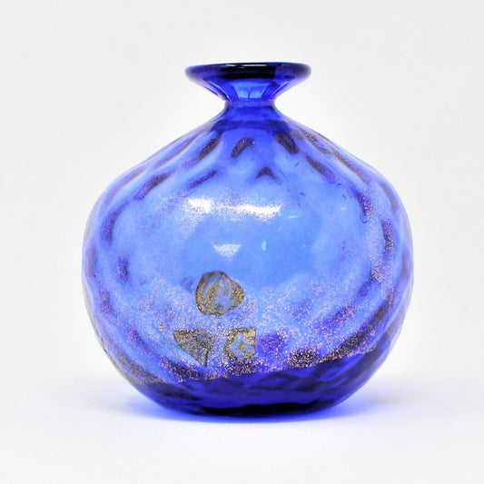 A vintage Murano glass vase with cobalt blue color and gold leaf embossing, Murrhines, with a rounded top and a bulbous body.