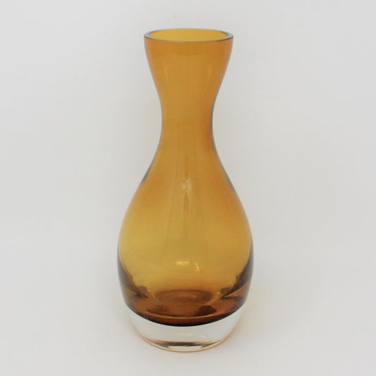 A conical blown glass vase with a topaz/amber color and a clear heavy bottom, Poland.