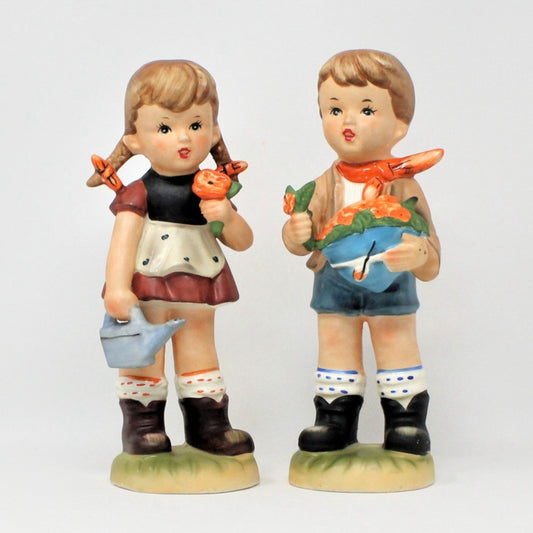 Mid Century figurines, boy & girl gardening