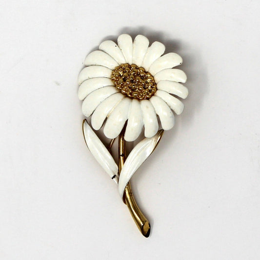 Vintage Monet Brooch, White enamel flower-shaped brooch with gold tone center and stem.