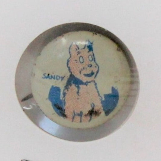 Vintage advertising button, mini pinback featuring an illustration of Sandy the Dog from Little Orphan Annie comic strip, with a rim reading 'COPR. 1945 Famous Artists Syn.  Kellogg's Advertising