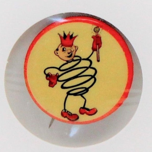 A vintage advertising pinback, King Koil logo, featuring a colorful illustration of a character on a yellow and red background, with a metallic pin backing.