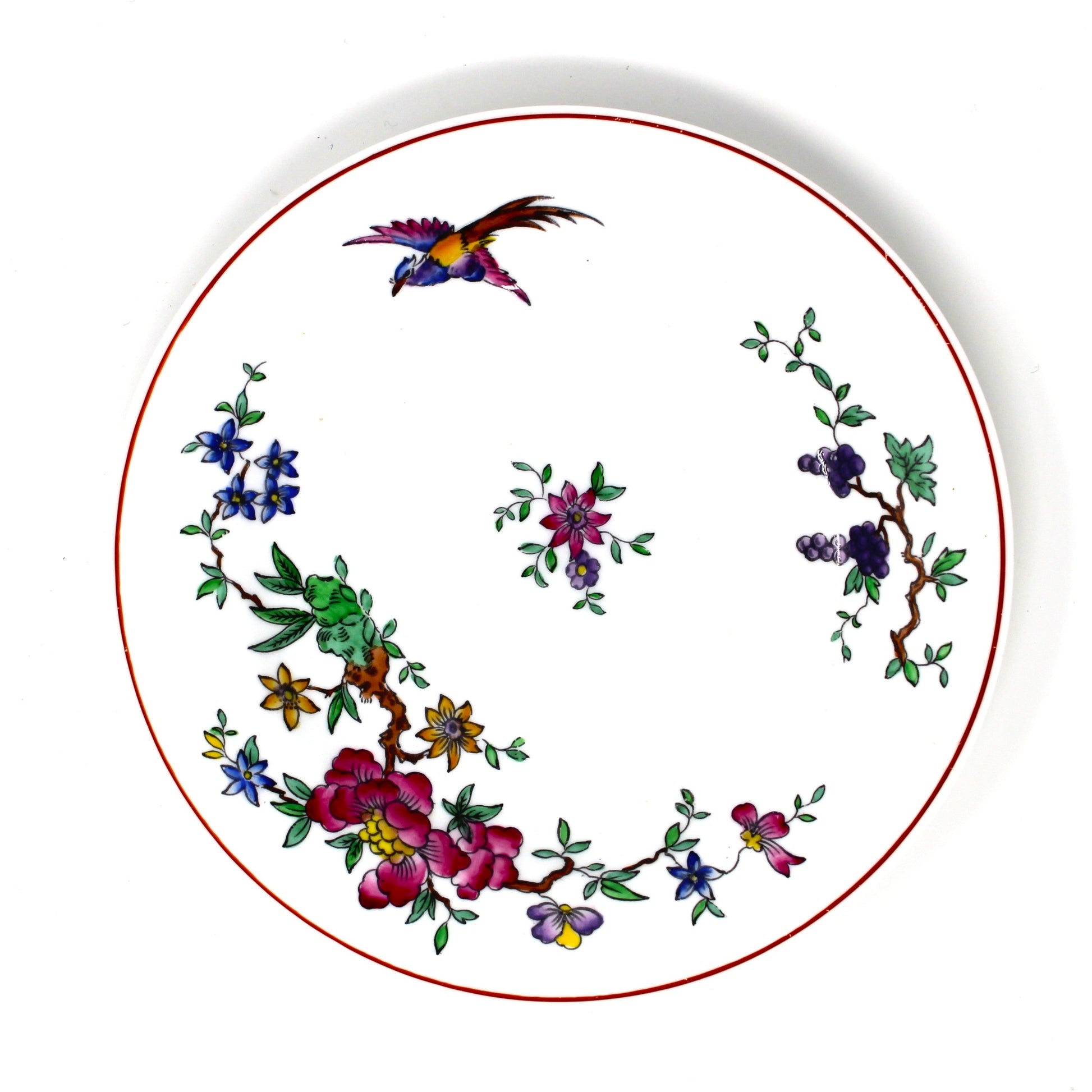 Decorative plate with floral and bird design on a white background