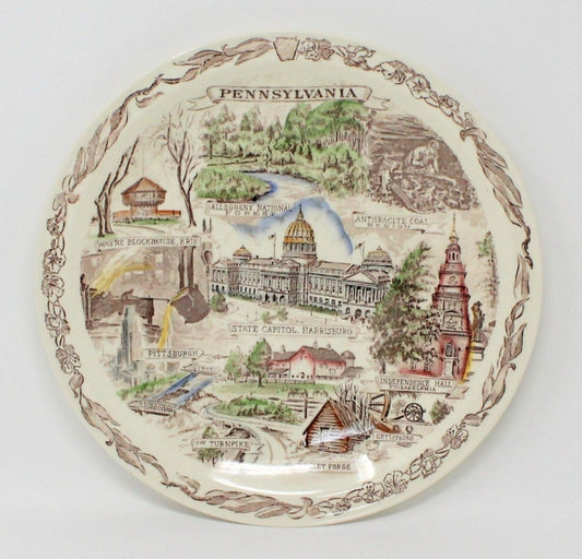 A vintage collectible Pennsylvania State Plate.  Decorative ceramic souvenir plate featuring various landmarks and scenes from the state. Vernon Kilns Pottery.