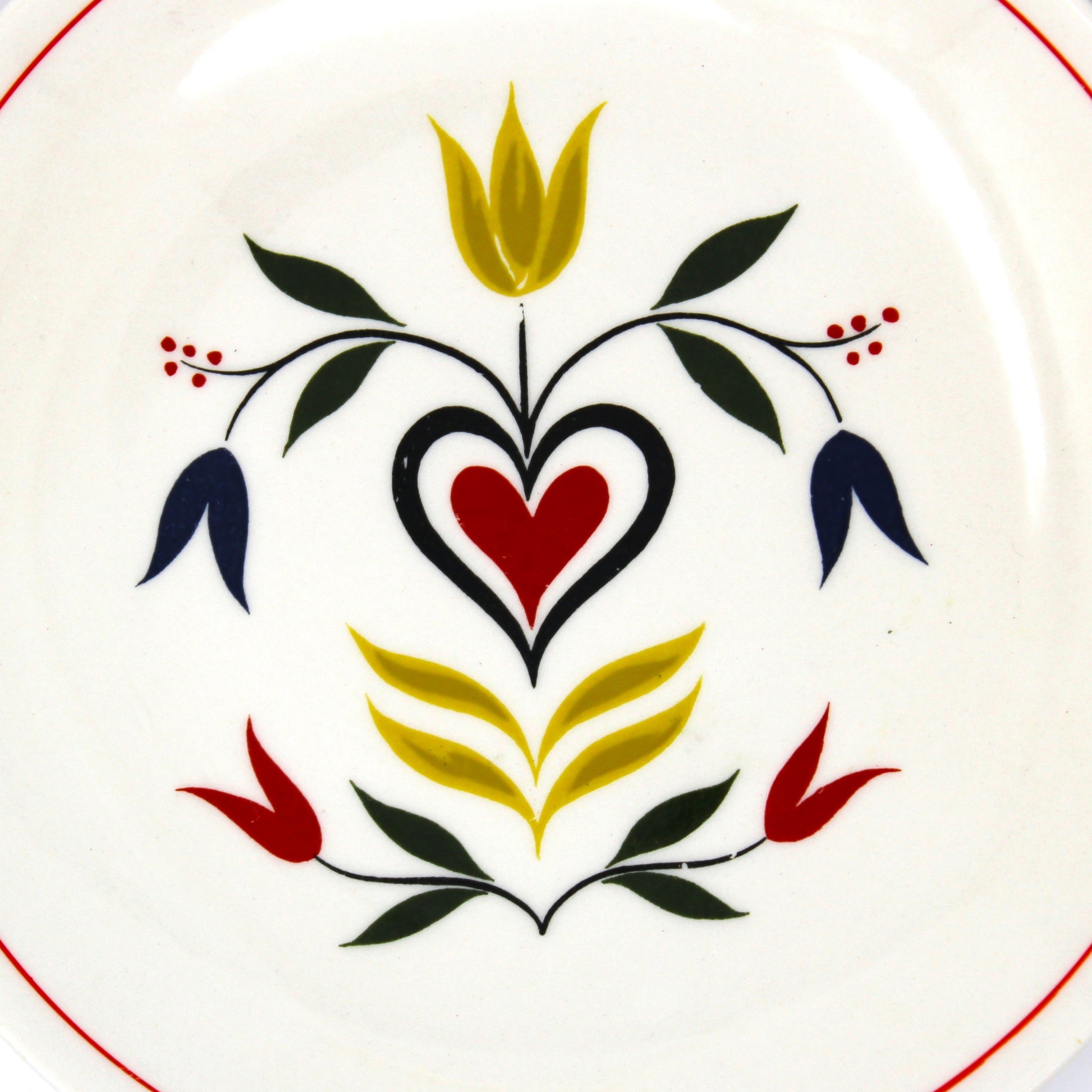 Decorative plate with floral design on an off-white background