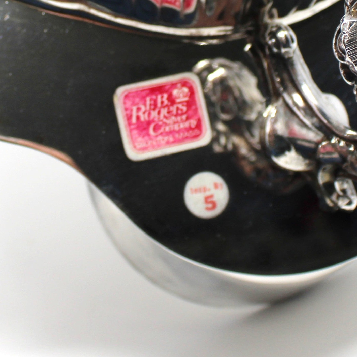 Close-up of a original FB Rogers brand sticker on silverplated serving bowl