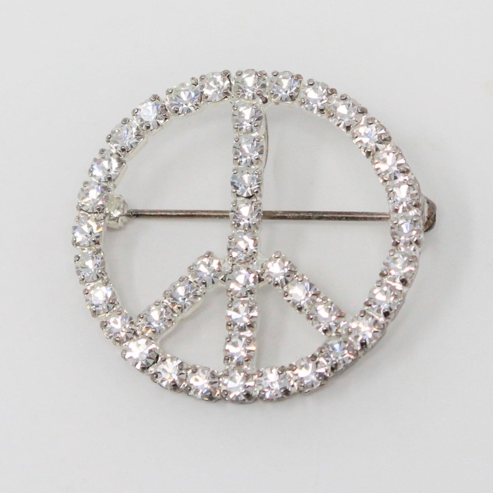 Vintage brooch, peace sign, silver and clear rhinestones