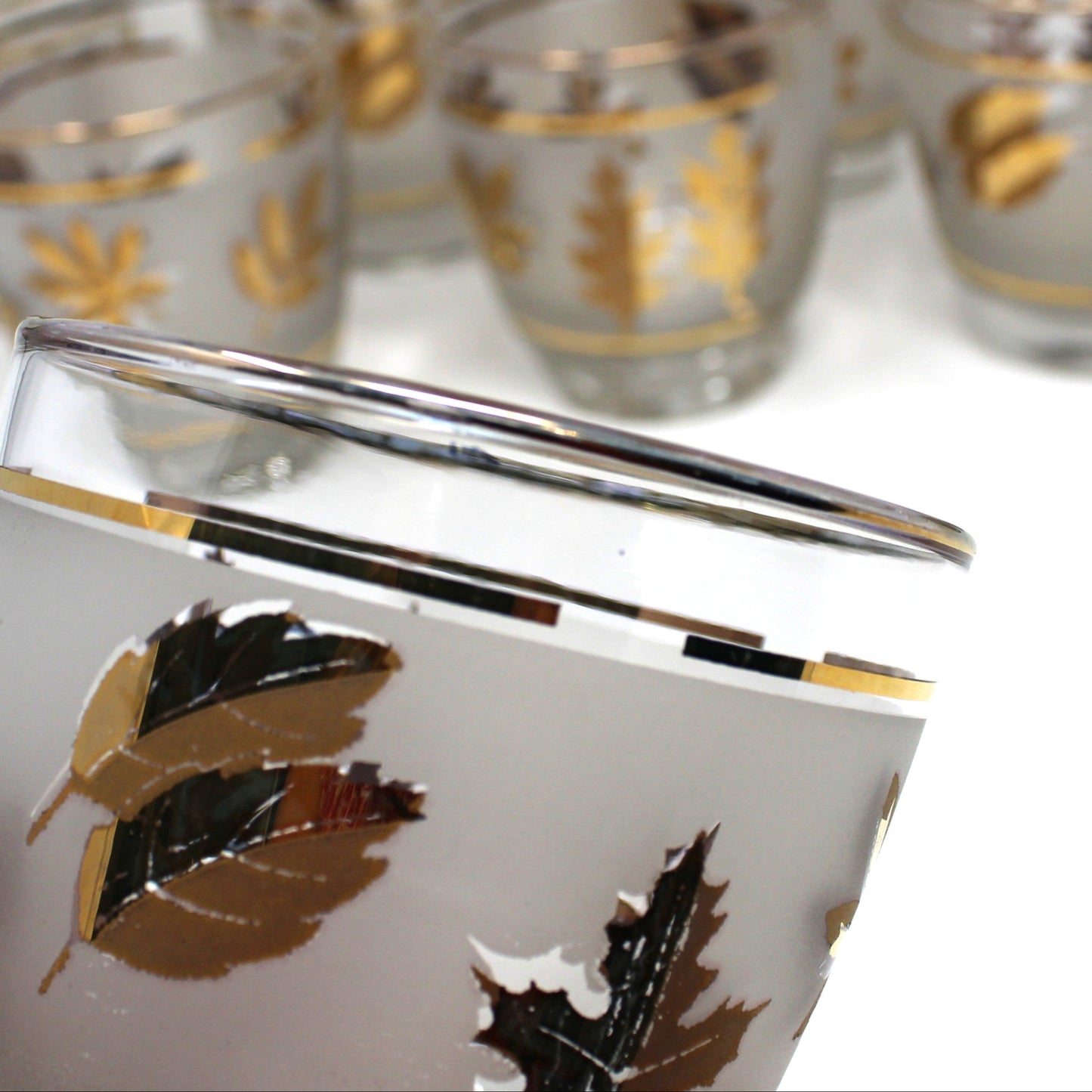 Set of tumblers with leaf design on a white background