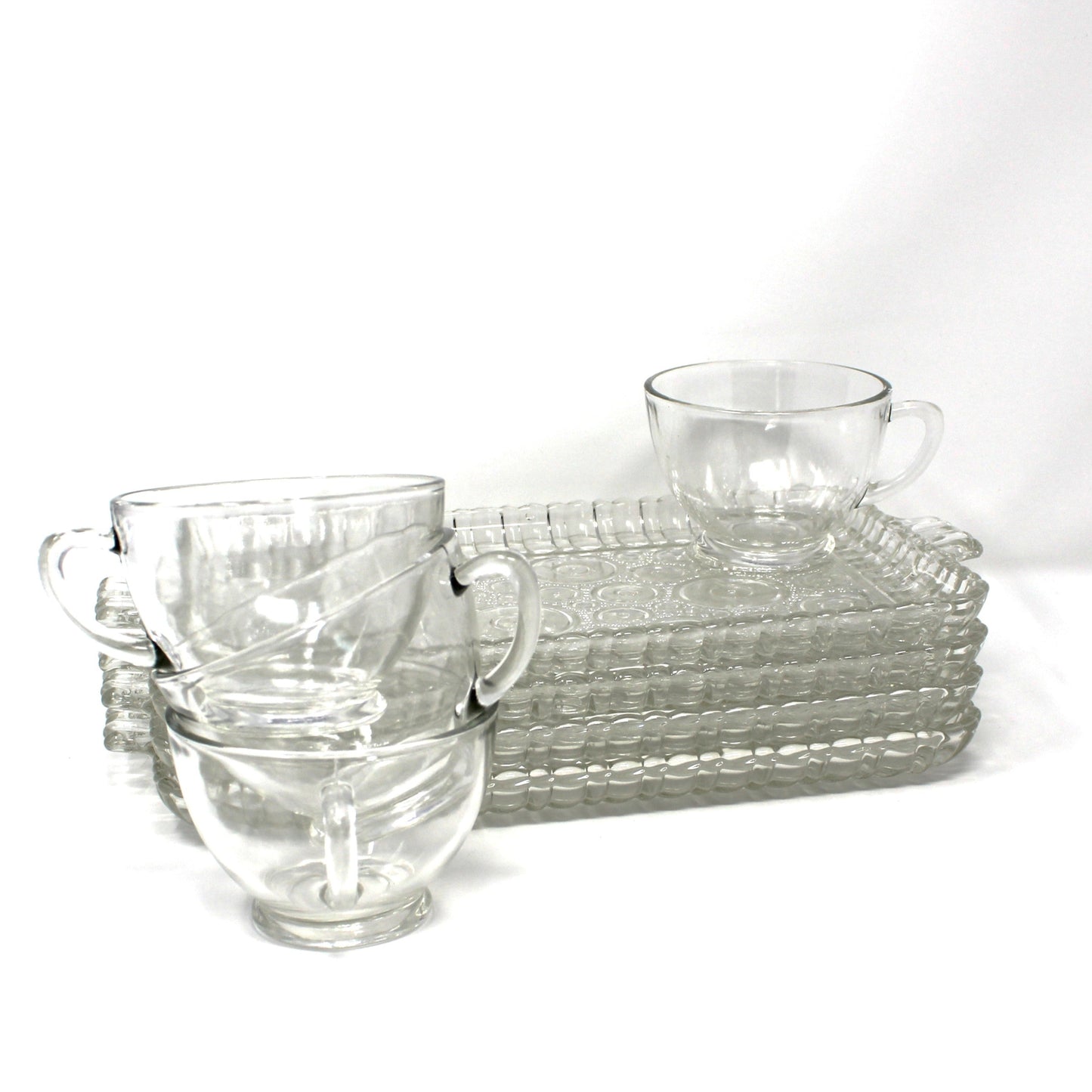 Set of 4 Serva-Snack sets. Clear glass plates and cups in Colonial Lady pattern.