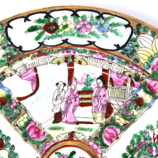 Up close view of reserve on Rose Medallion Decorative plate with intricate florals and people.