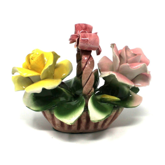 Vintage Capodimonte ceramic roses basket with pink bow and twisted handle.