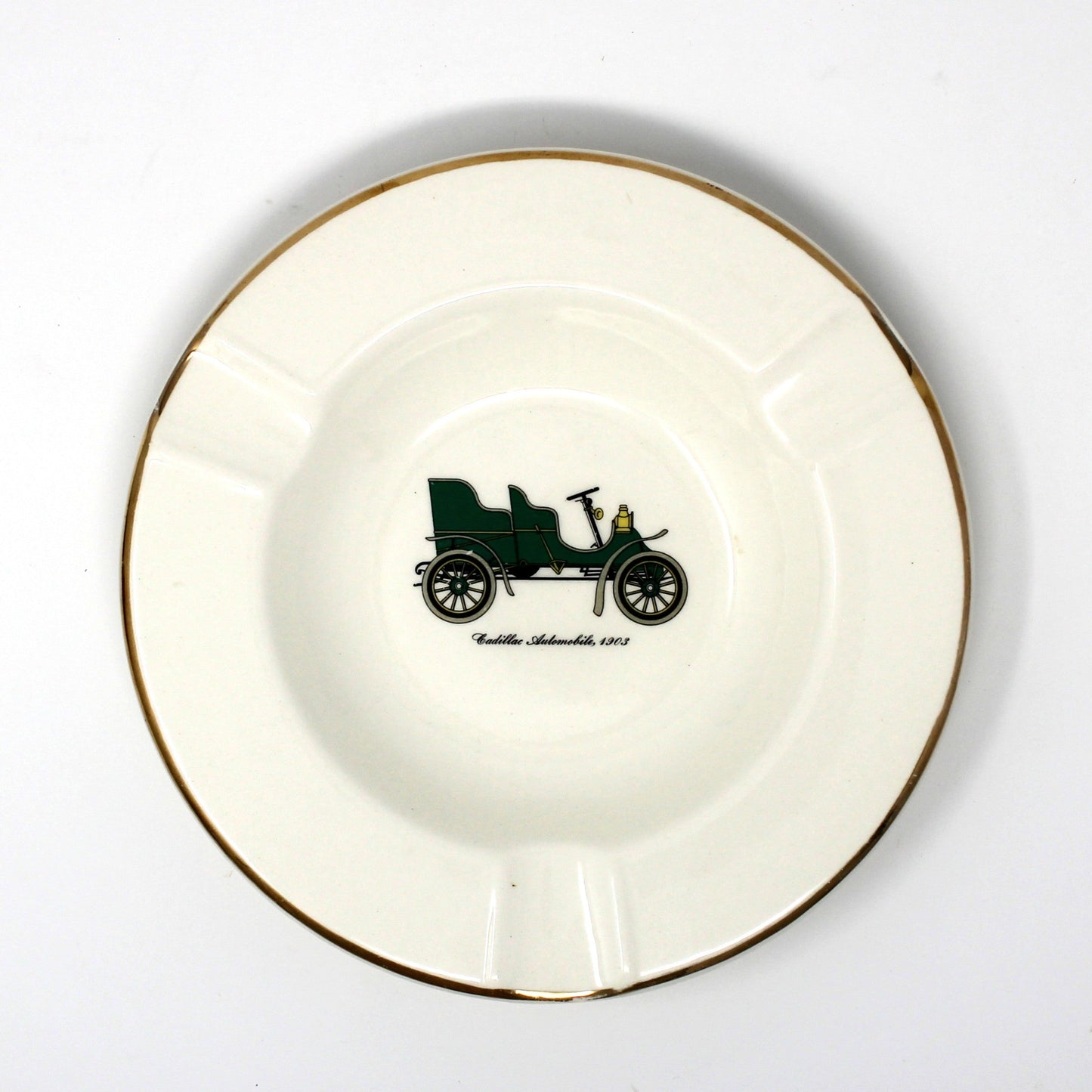 Vintage advertising ashtray with antique car design. Promotional item for Warren Cadillac Inc.