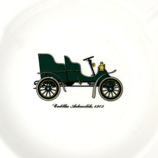 Close up of vintage ashtray with decal of an old-fashioned car: Cadillac Automobile, 1903.