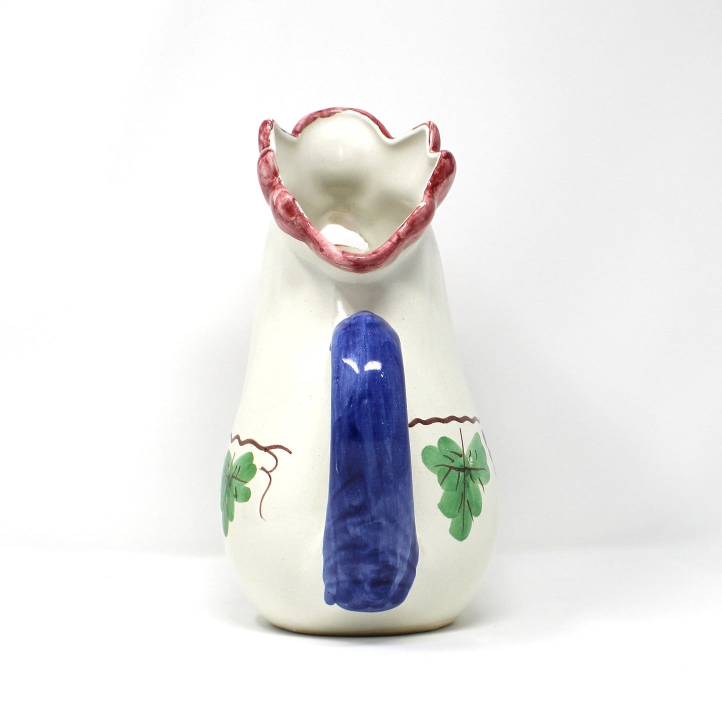 Back view of rooster-shaped pitcher. Italian Vietri ceramic.