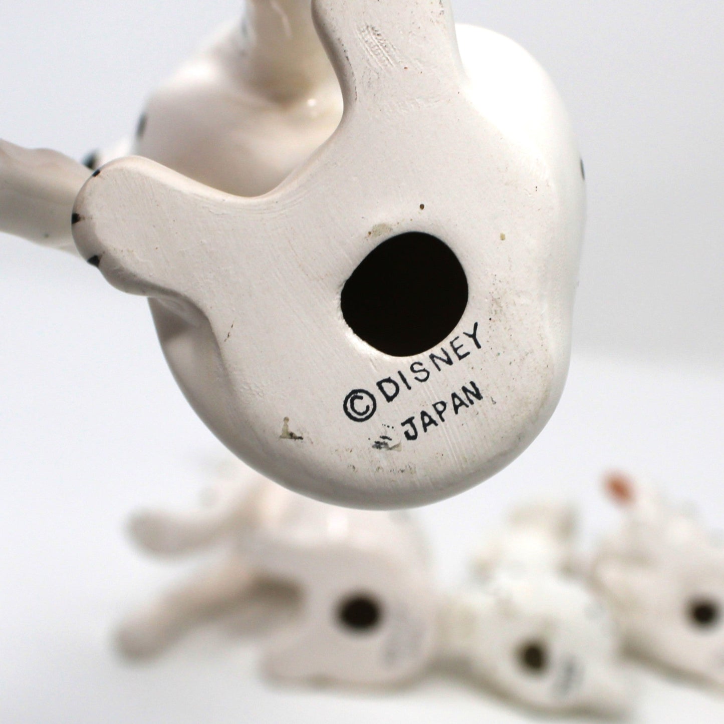 Close up view of Vintage Disney backstamp on porcelain 101 Dalmatians figurine.