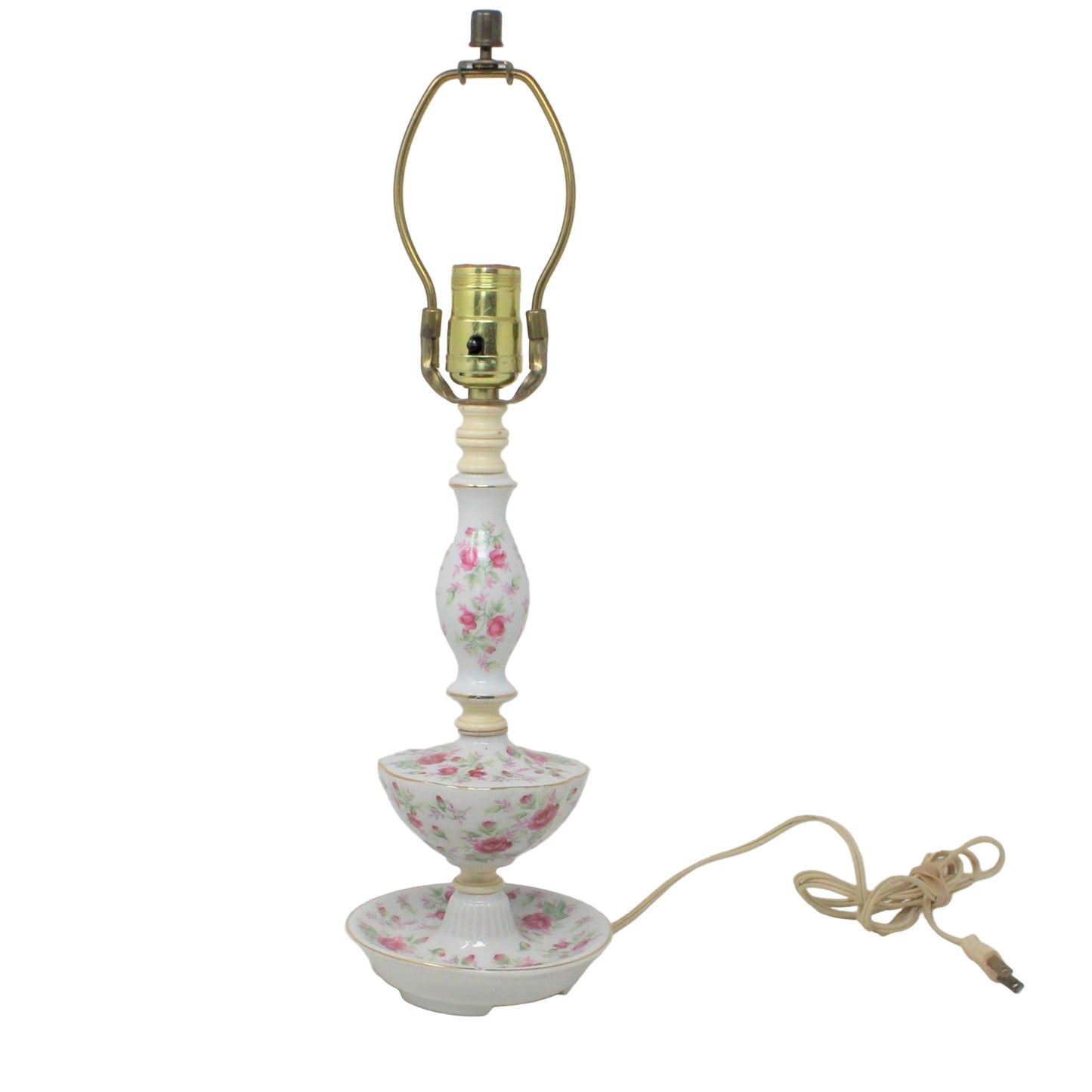 A vintage table lamp with a tiered porcelain base featuring pink roses, a gold-colored metal harp. Mid Century