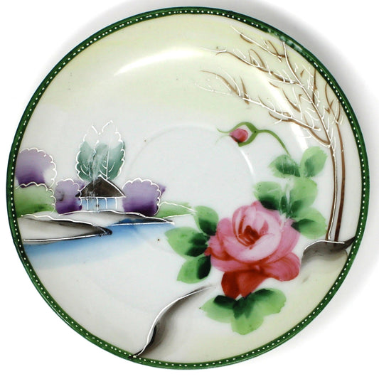 design on vintage tea set featuring pink roses and a house by the water.  Hand painted moriage.  Japan import.