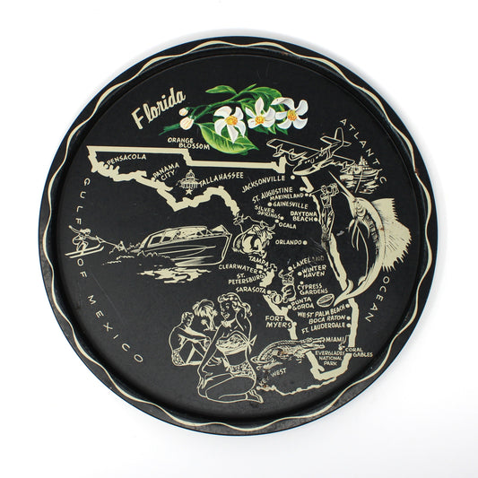 Decorative metal tin tray, with a map of Florida and various landmarks, on a black background. Vintage Japan Mid Century Collectible
