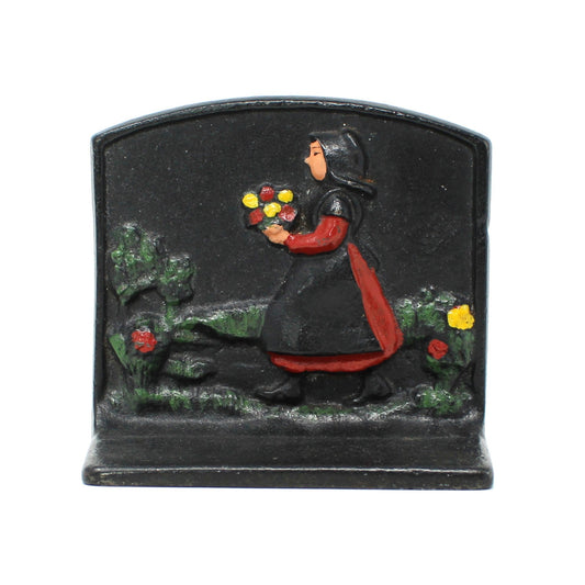 Vintage cast iron bookend. Design of an Amish girl holding flowers by Wilton Products, USA