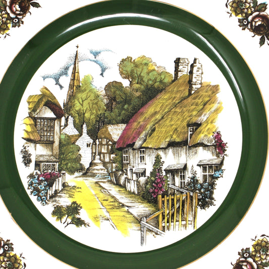 close up view of vintage decorative plate with a village scene and floral border by Wood and Sons