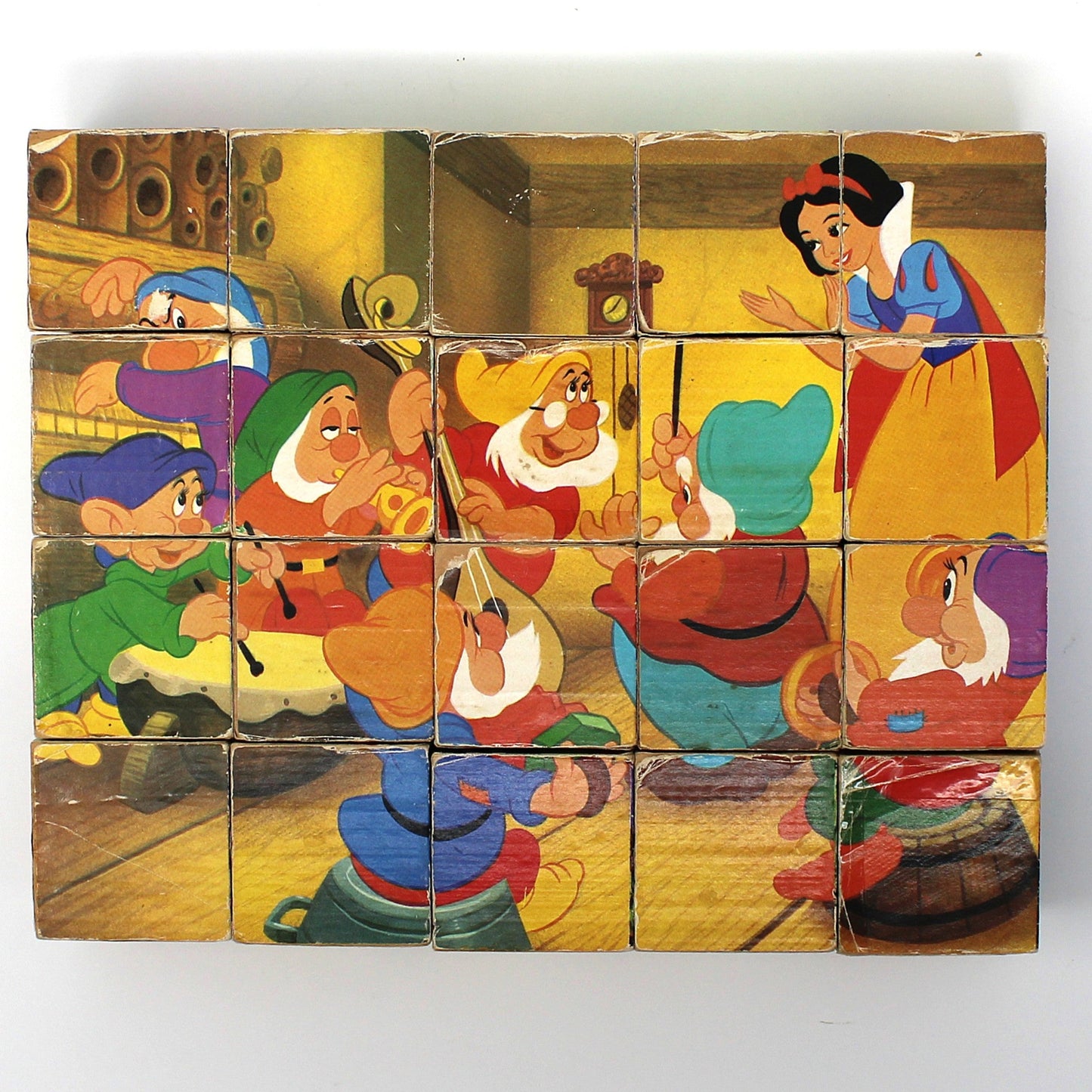 Vintage children's wooden block puzzle with animated Disney characters from 'Snow White and the Seven Dwarfs.