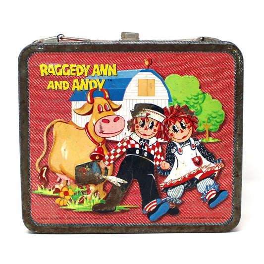 Vintage children's lunchbox with cartoon characters Raggedy Ann and Andy, metal made by Aladdin.