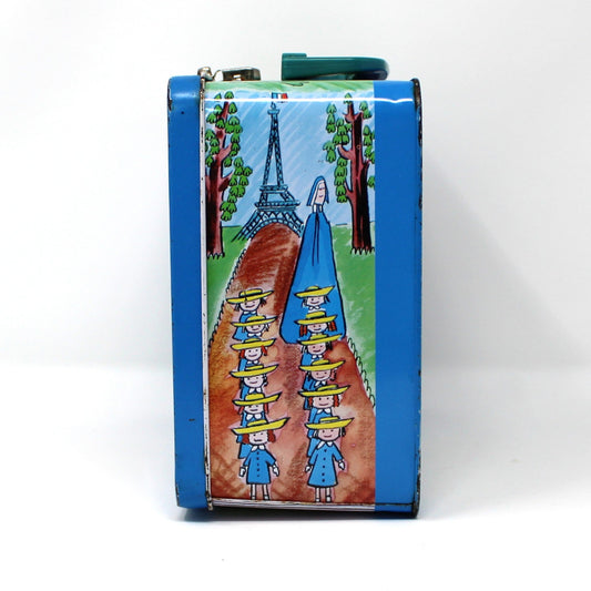 Colorful vintage lunch box with a scenic design on a white background