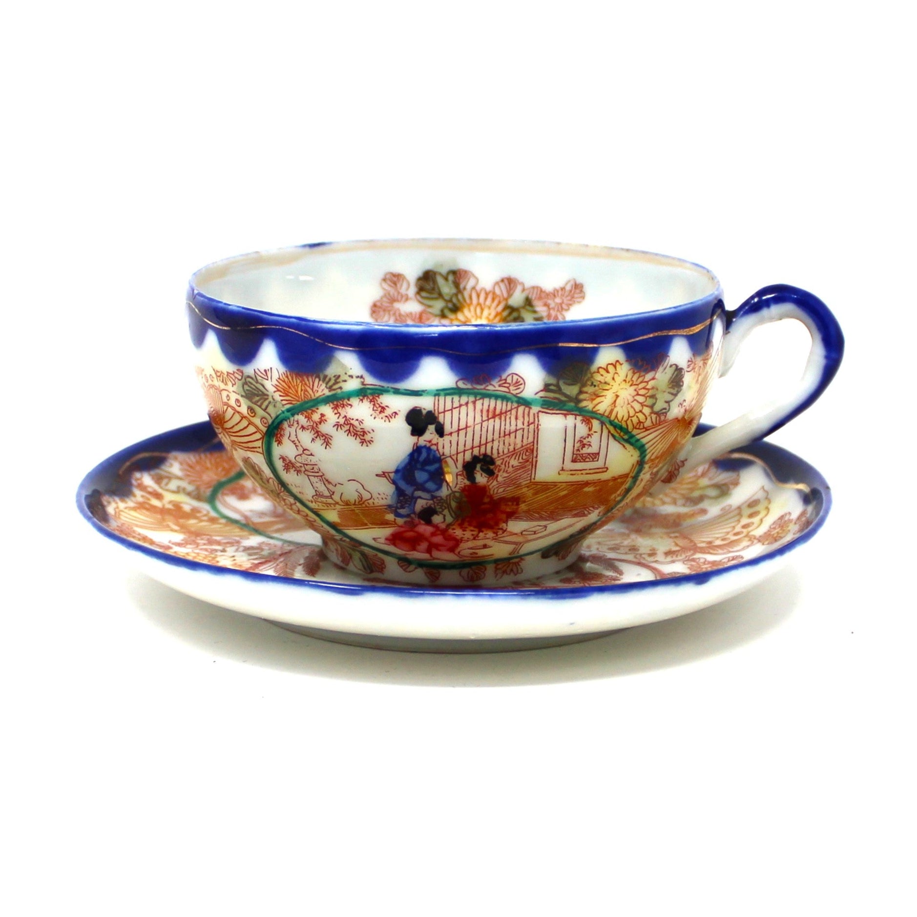 Antique Geisha Girl teacup and saucer with cobalt blue rim and gold accents.