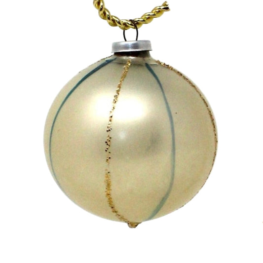A vintage glass ball ornament with pearl white finish, blue and gold glitter stripes with metal hanging cap.