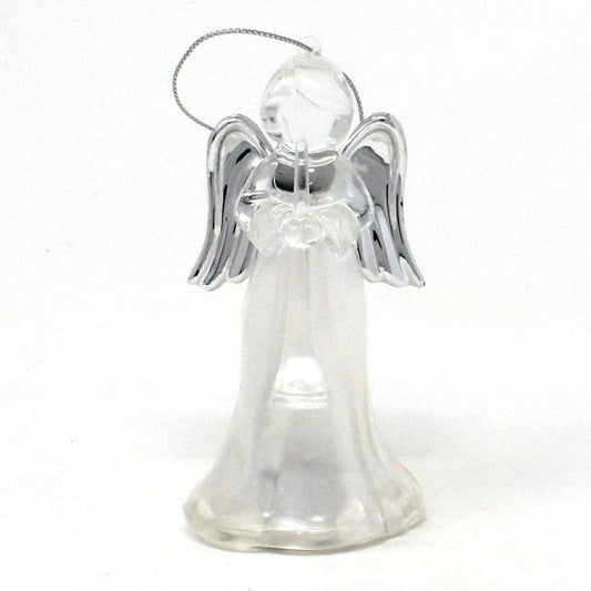 A lighted angel ornament with silver wings, holding a trumpet, in a clear plastic frosted gown.