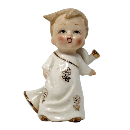 Vintage porcelain figurine, musician carrying trumpet, hand painted, with gold accents.  Japan, Mid Century.