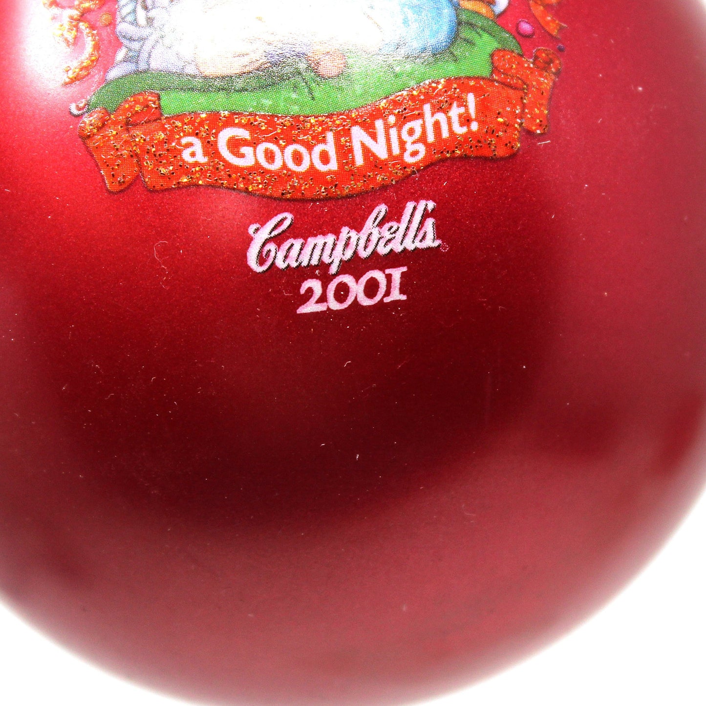 Red ball with a character and 'Campbell's 2001' text on a white background