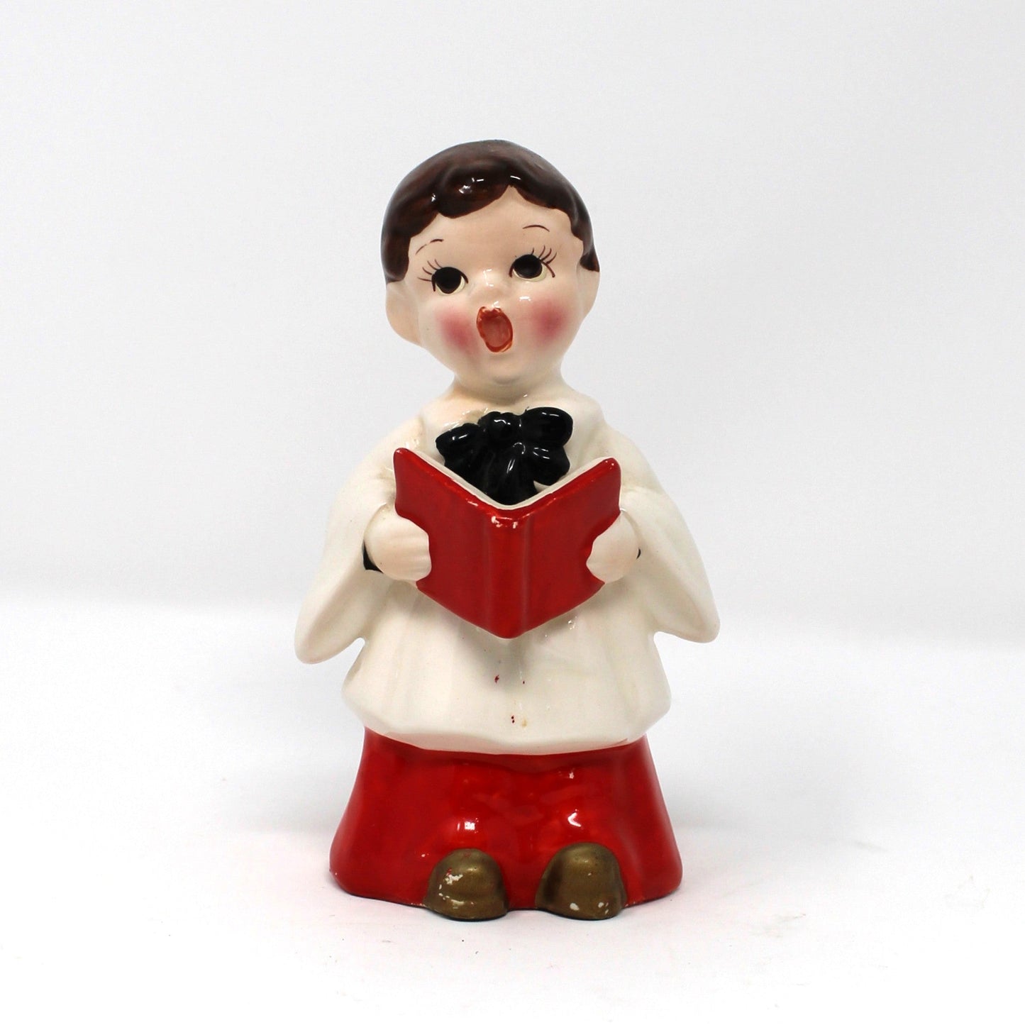 Vintage holiday figurine, ceramic choir boy holding a red hymnal book. Hand Painted Mid Century Japan import.