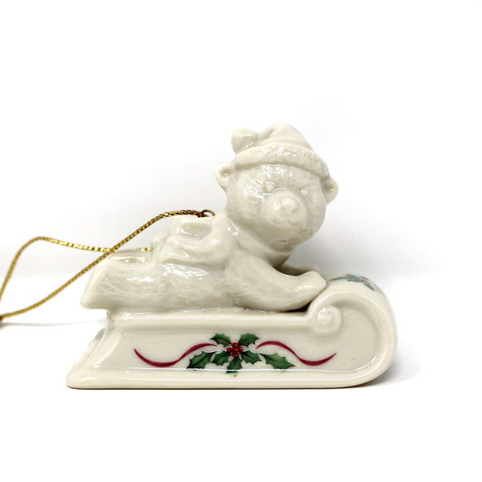 Retired Lenox Christmas Ornament, Sledding Teddy Porcelain with Holly Details, in Original Box.  Vintage Collectible.