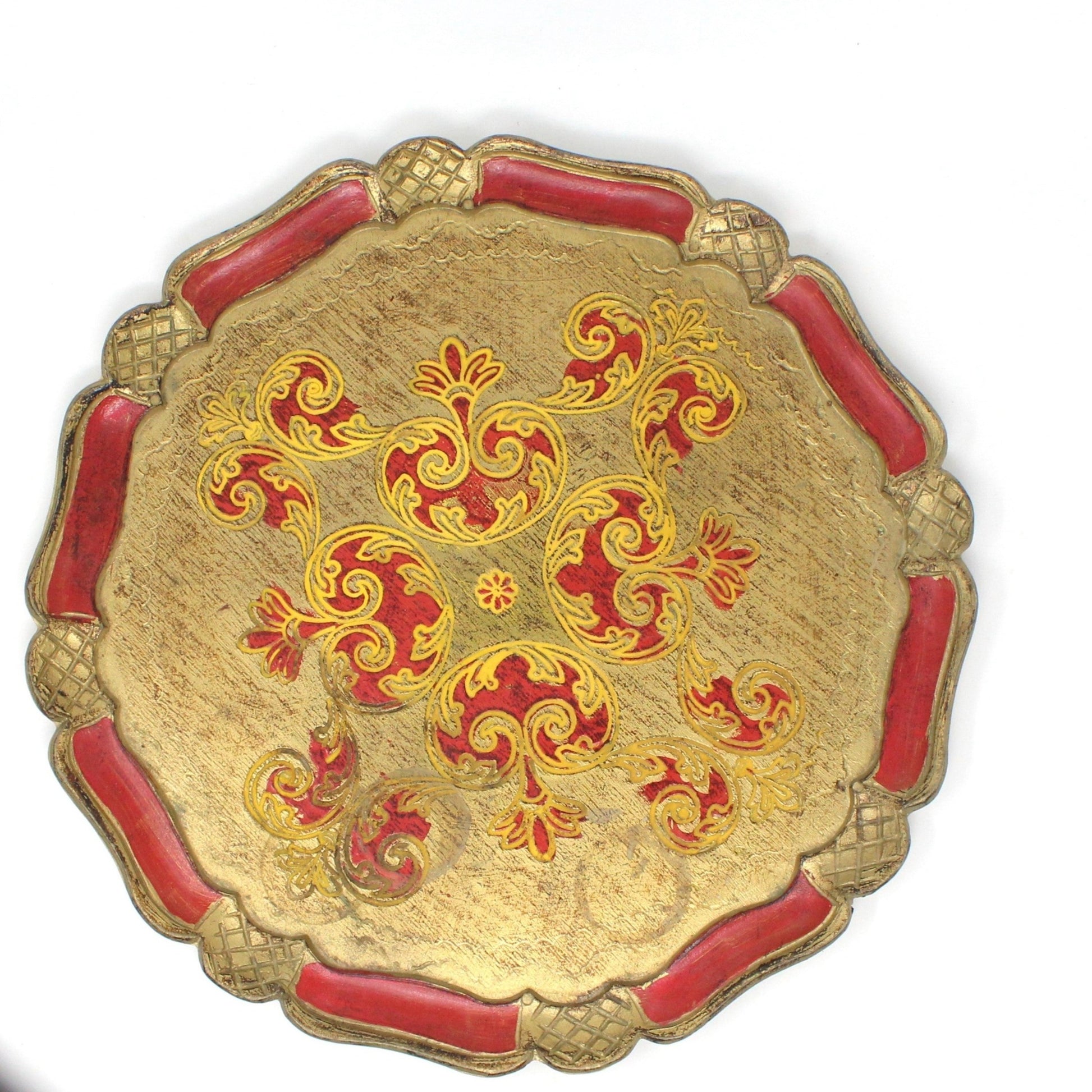 A vintage Italian Florentine hand-carved wood tray with a red and gold color scheme and traditional Renaissance art designs.