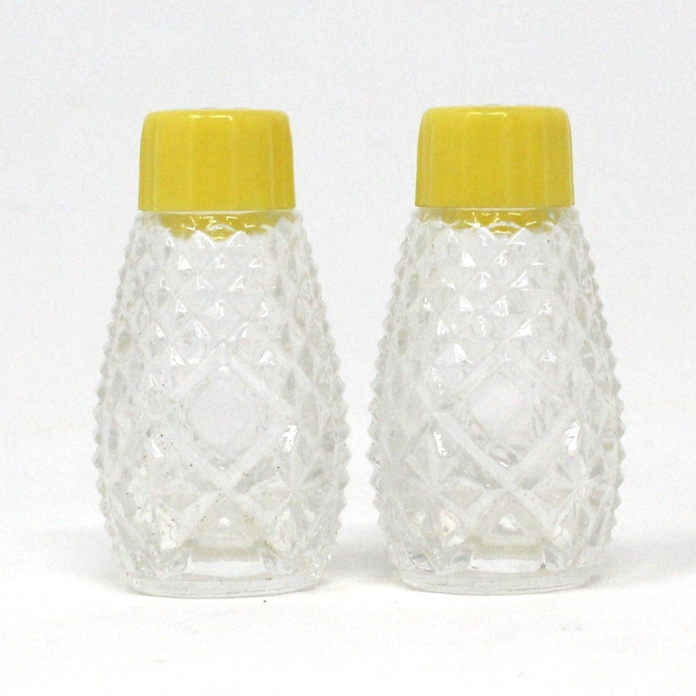 Salt and Pepper Shakers, Pressed Glass with Yellow Bakelite Tops, Vintage
