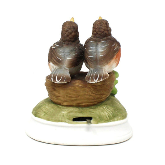 back view of vintage Gorham musical figurine with two Robin birds.  Music box.
