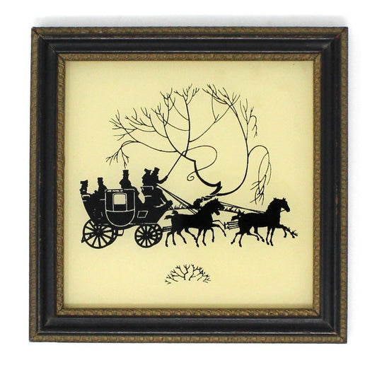 Vintage framed silhouette of a horse-drawn stagecoach with people inside, in black and white color scheme, with a wooden frame.