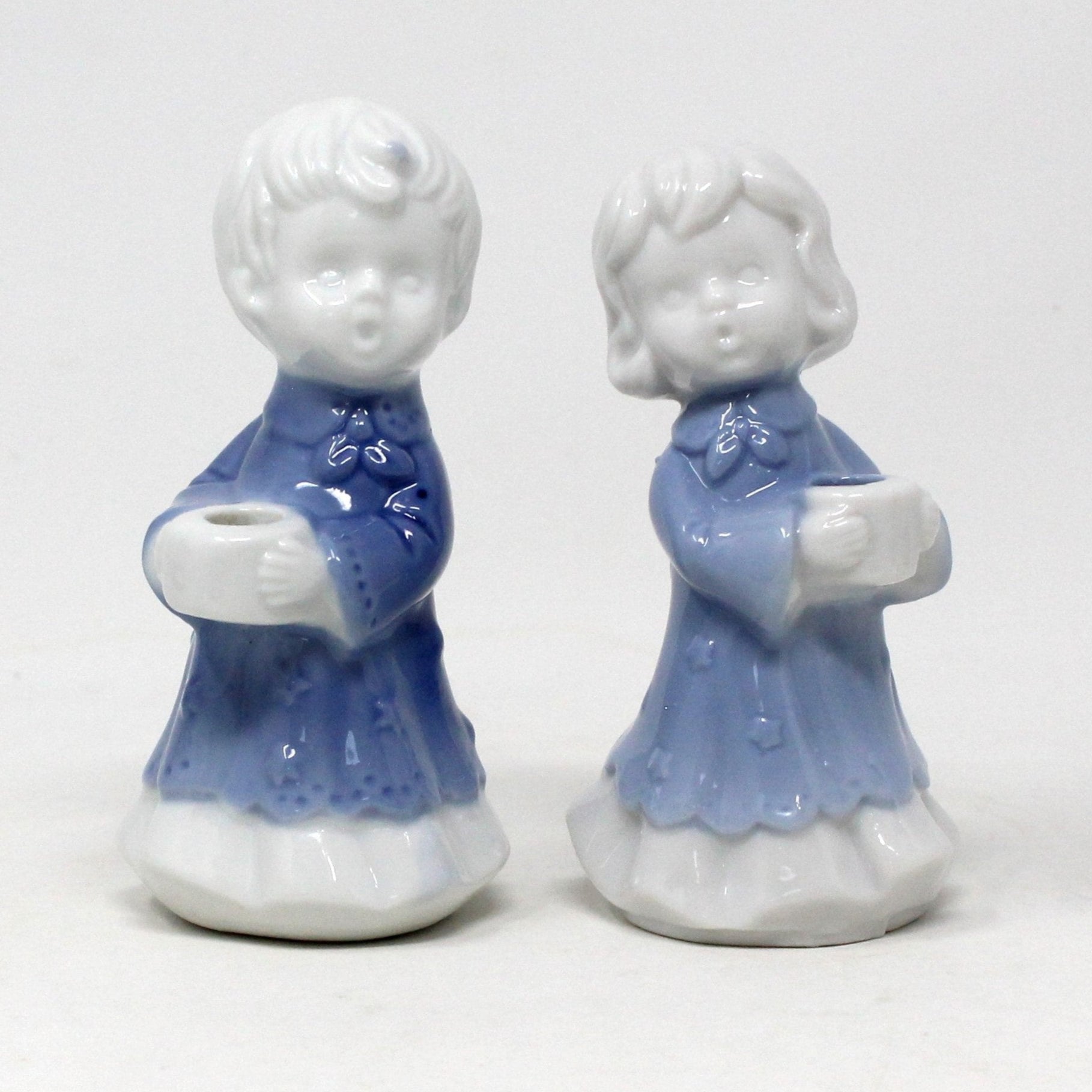 Two porcelain figures candle holders by Anderson.  blue and white porcelain children