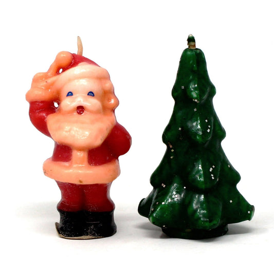 A set of two vintage Gurley candles, one in the shape of Santa Claus and the other in the shape of a Christmas tree with glitter.  Never been burned.