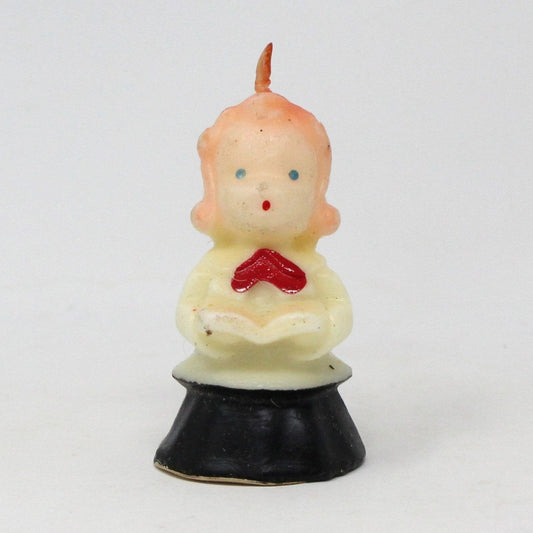 Vintage Gurley decorative candle in the shape of a choir singer girl with a red bow and black and white gown.  Never been used.