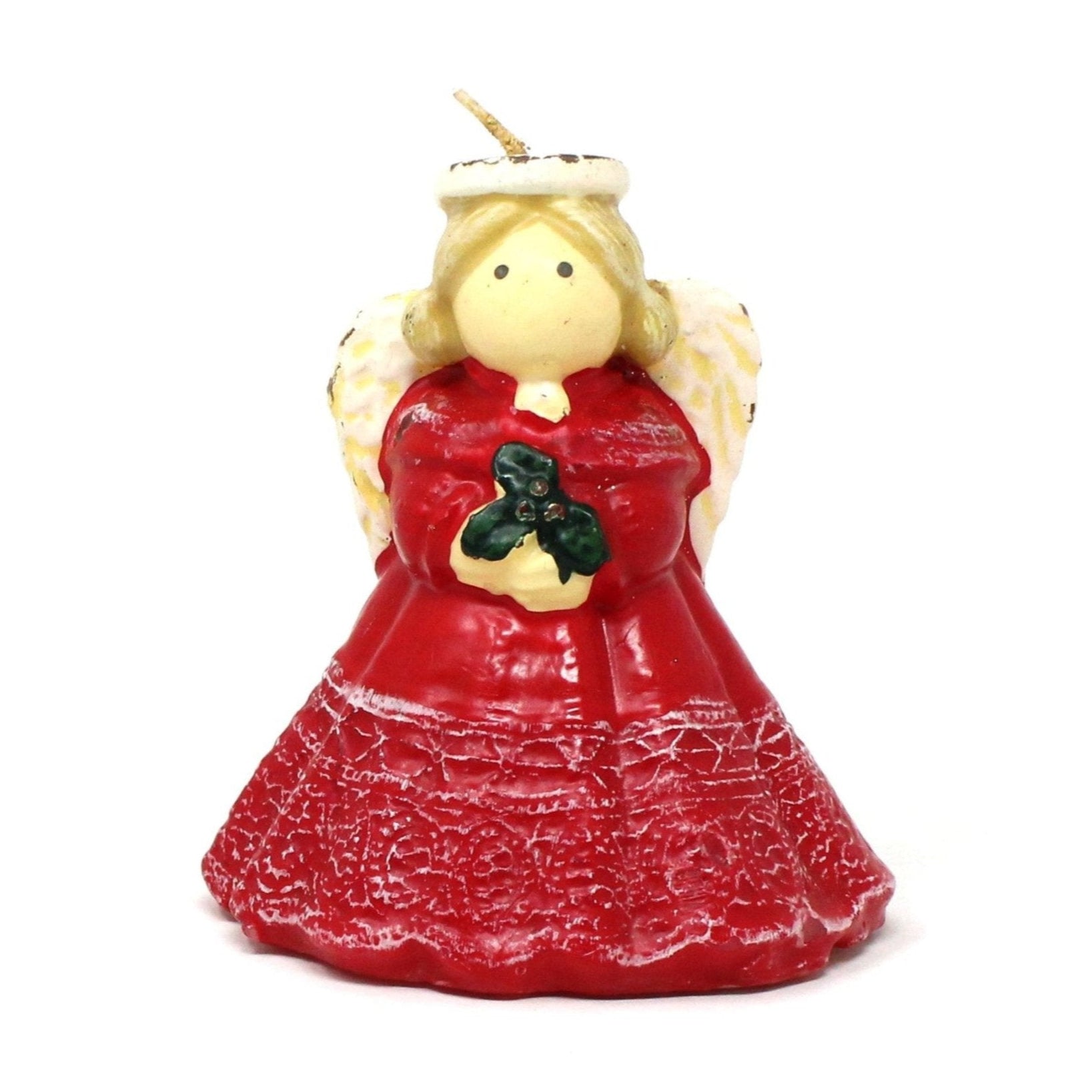 A vintage Christmas angel candle in red dress with white wings and halo, holding a sprig of holly.  Never been burned.