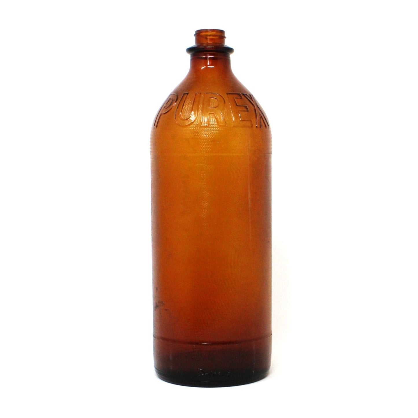 A vintage Purex Duraglas amber brown glass bottle with embossed text, displaying a stippled bottom, indicative of mid-century old glassware.